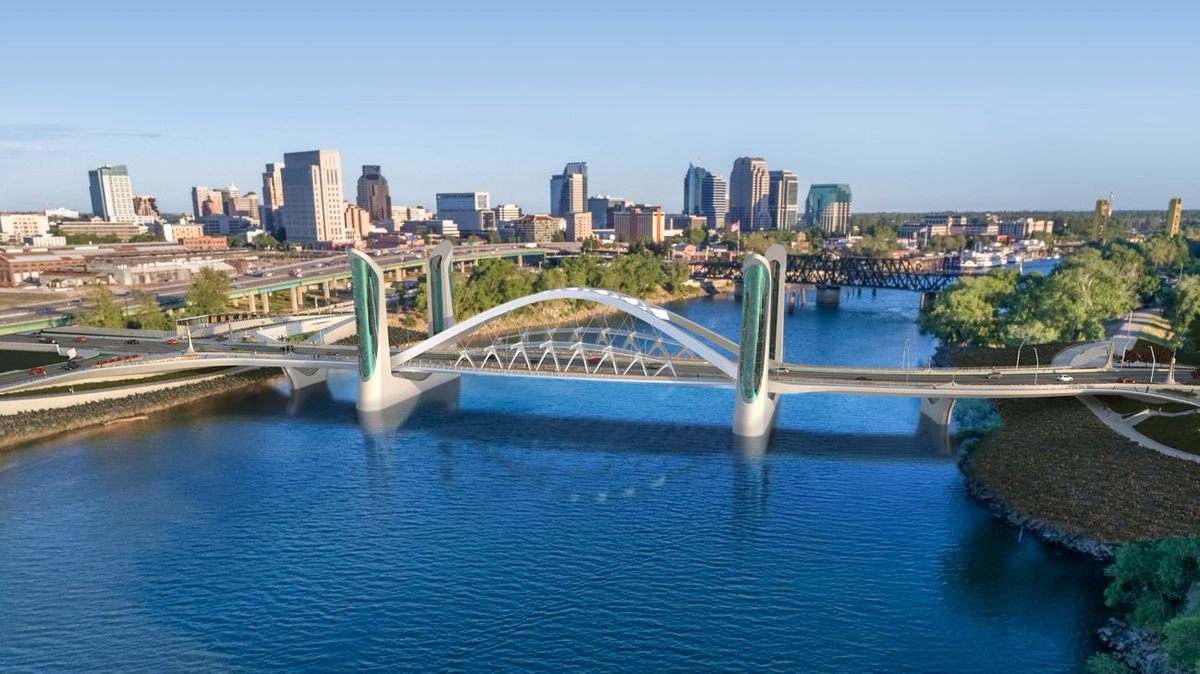 A bird’s-eye view rendering of the I Street Bridge replacement. Built upstream of the current one, it will better facilitate travel between West Sacramento and the Downtown Railyards. A bird’s-eye view rendering of the I Street Bridge replacement. Built upstream of the current one, it will better facilitate travel between West Sacramento and the Downtown Railyards.